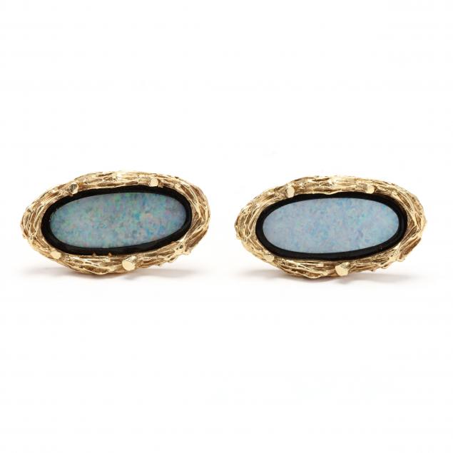 Appraisal: GOLD AND OPAL DOUBLET CUFFLINKS Of oval form inlaid with