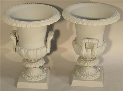 Appraisal: ELEGANT PAIR OF GARDEN URNS Of campagna form with upswept