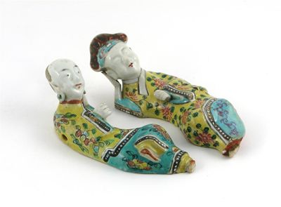 Appraisal: Two Chinese porcelain brush rests modelled as reclining figures of