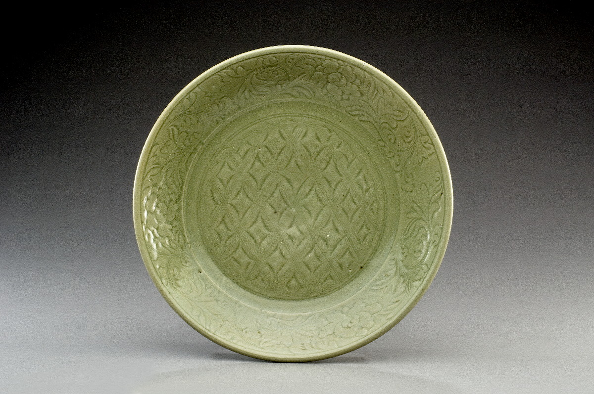 Appraisal: CHINESE CARVED CELADON CHARGER NINETEENTH CENTURY Carved in the center