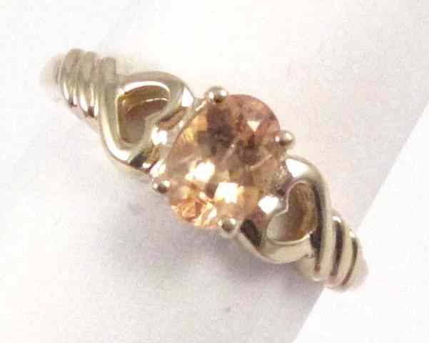 Appraisal: CITRINE AND FOURTEEN KARAT GOLD RING set with a single