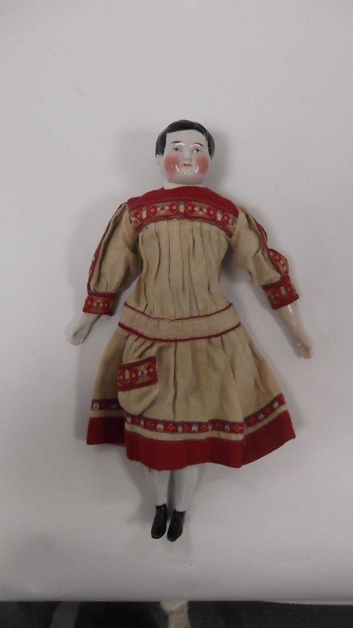 Appraisal: A German china head boy doll with black hair rosy