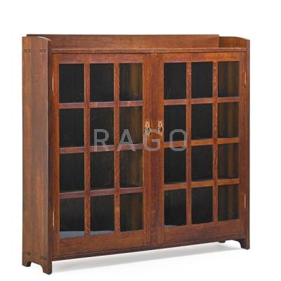 Appraisal: GUSTAV STICKLEY Double-door bookcase Eastwood NY ca Branded signature and