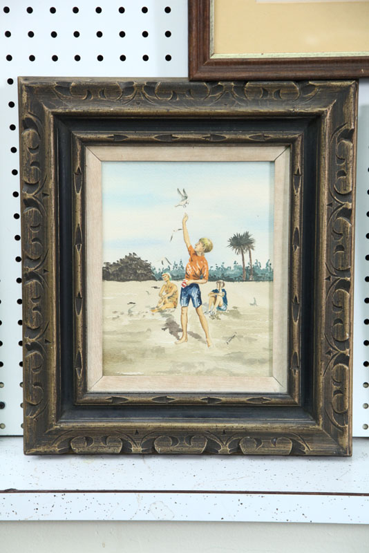 Appraisal: FRAMED WATERCOLOR Beach scene of a boy feeding seagulls Artist