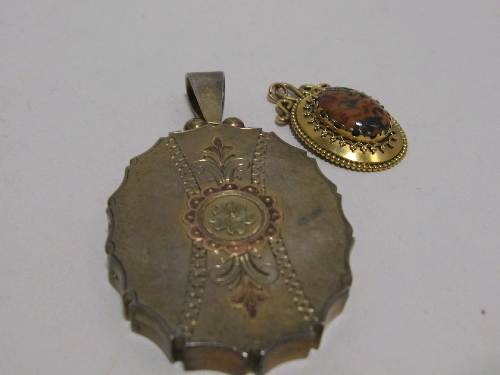 Appraisal: Lot comprising Victorian silver locket with engraved decoration and gold