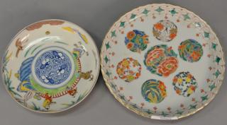 Appraisal: Two Chinese porcelain painted dishes with three hardwood stands including