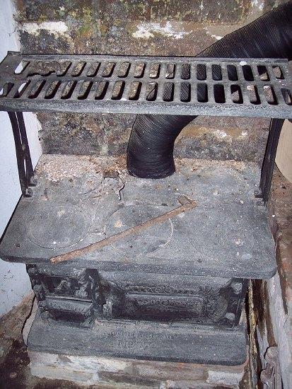 Appraisal: A cast iron stove the hinged door marked Bonnybridge Dover