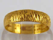 Appraisal: A carat gold bark effect band ring size N gms