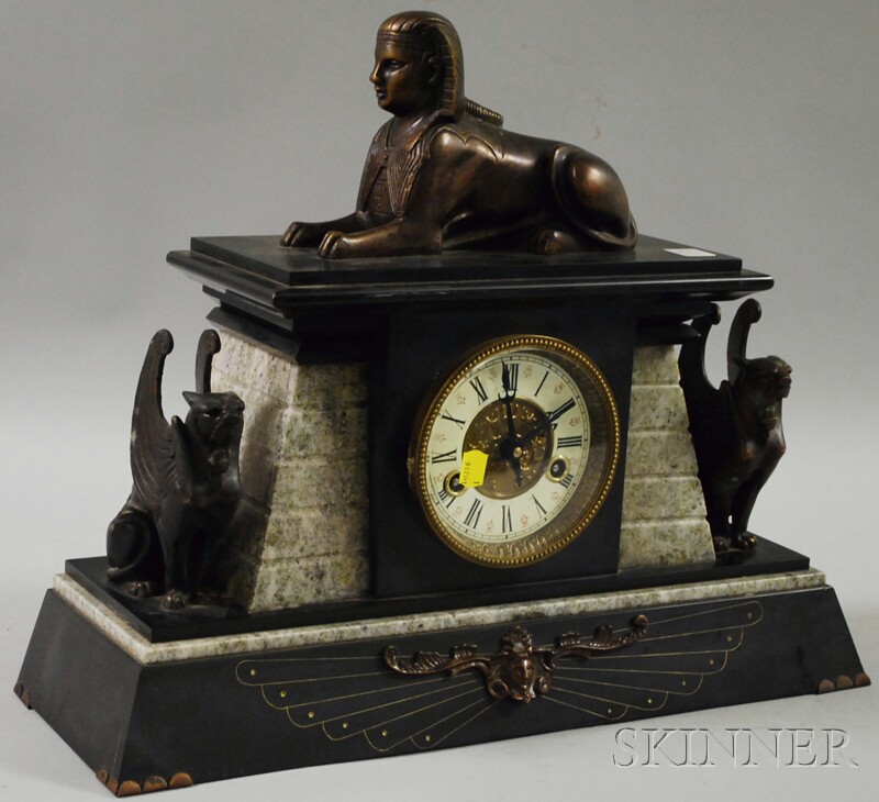 Appraisal: Egyptian Revival Metal Figural-mounted Stone and Slate Mantel Clock America