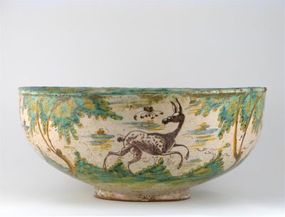 Appraisal: A massive Spanish Talavera maiolica bowl painted with a figure