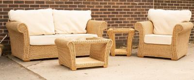 Appraisal: A wicker two-seater sofa an armchair and two side tables