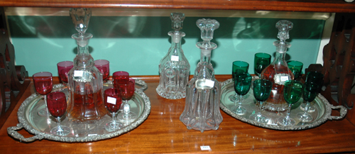 Appraisal: FOUR VICTORIAN GLASS DECANTERS Together with four sterling silver decanter