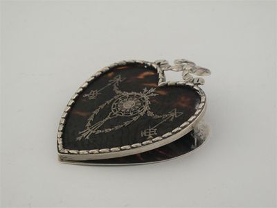 Appraisal: An Edwardian mounted tortoiseshell letter clip in the form of