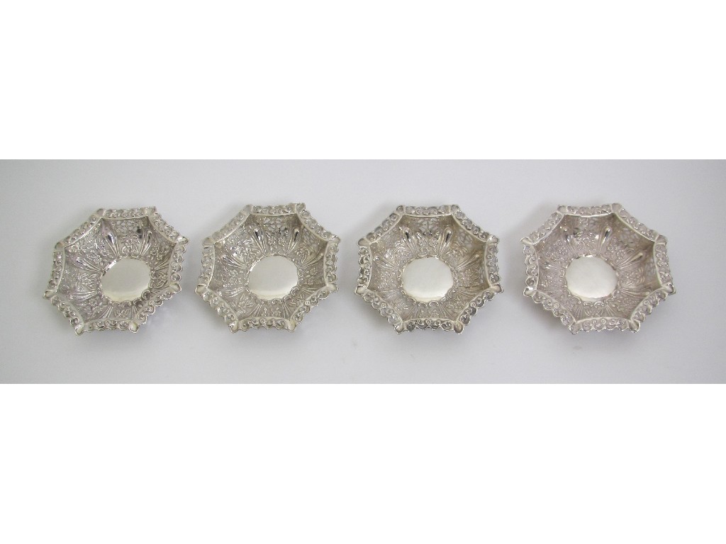 Appraisal: A set of four silver octagonal pierced bonbon dishes embossed