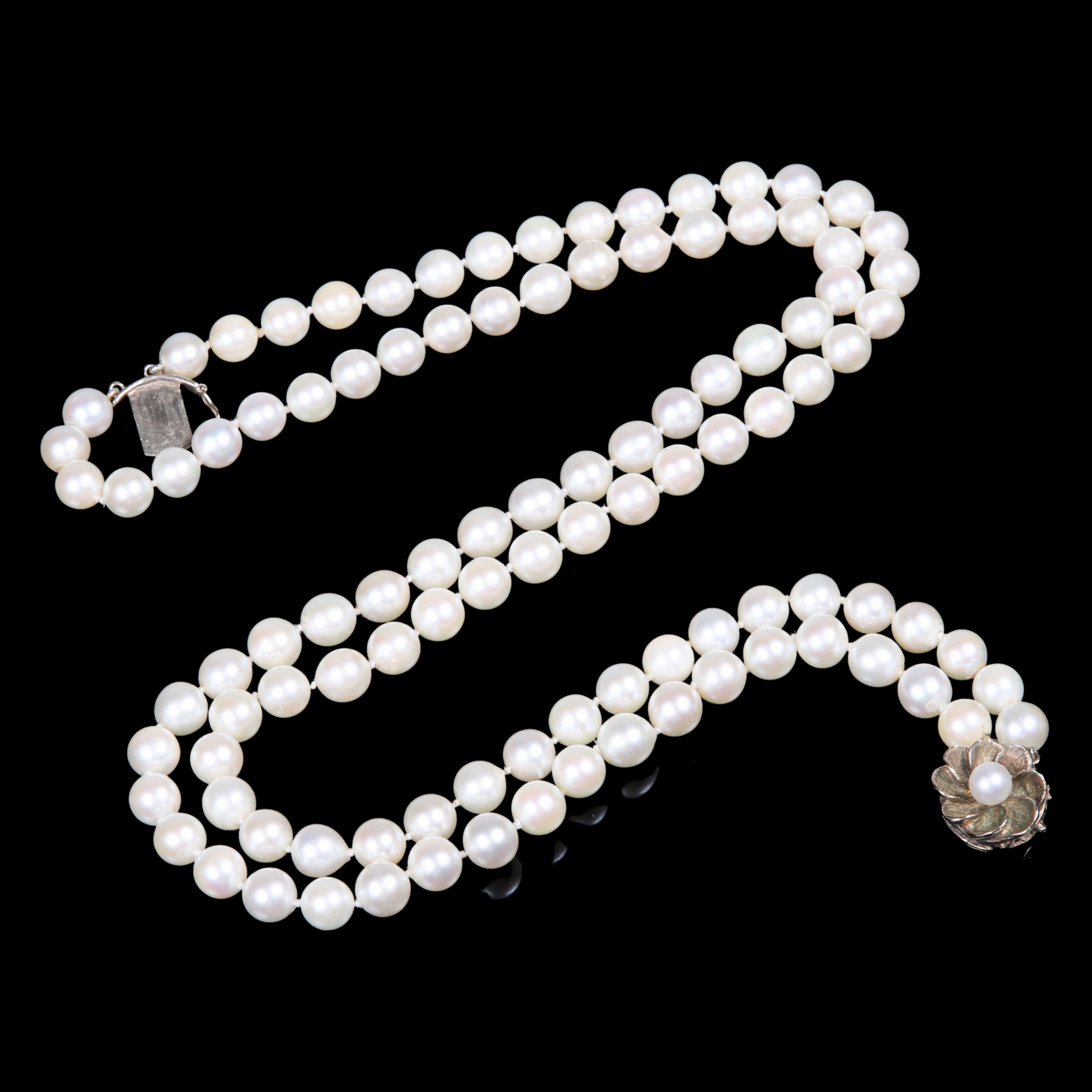 Appraisal: Multi-strand cultured pearl necklace with flower form K pearl centered