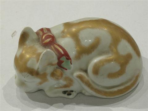 Appraisal: JAPANESE ARITA PORCELAIN MODEL OF A CAT Modeled in a