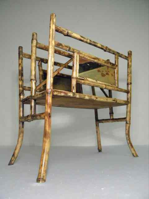 Appraisal: Bamboo cane magazine rack with two hand painted oriental panels