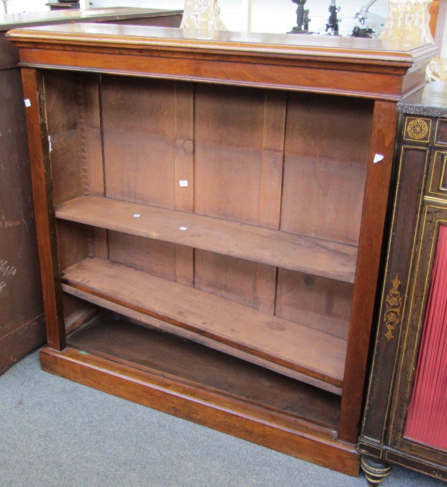 Appraisal: A Victorian walnut floor standing open bookcase on plinth base