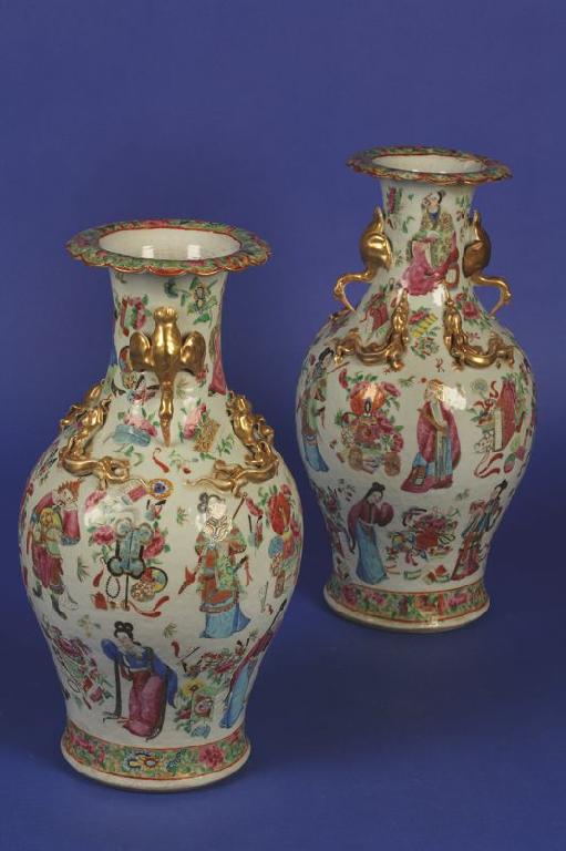 Appraisal: A PAIR OF CANTON FAMILLE ROSE VASES enamelled in polychrome