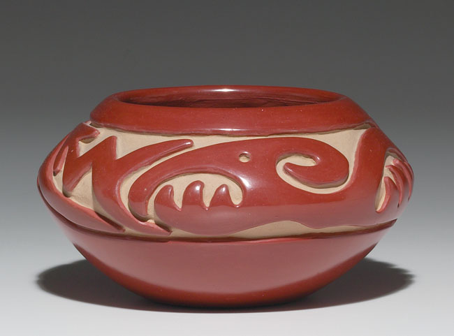 Appraisal: Santa Clara pot carved avanyu design covered in a polished