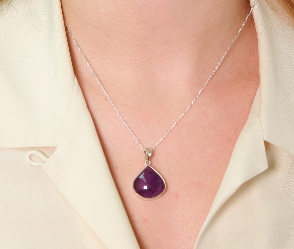 Appraisal: Sterling silver necklace hung with a Amethyst cabochon pear shaped