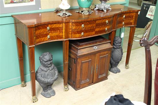 Appraisal: SERVER Mahogany with a crossbanded top serpentine front lion head