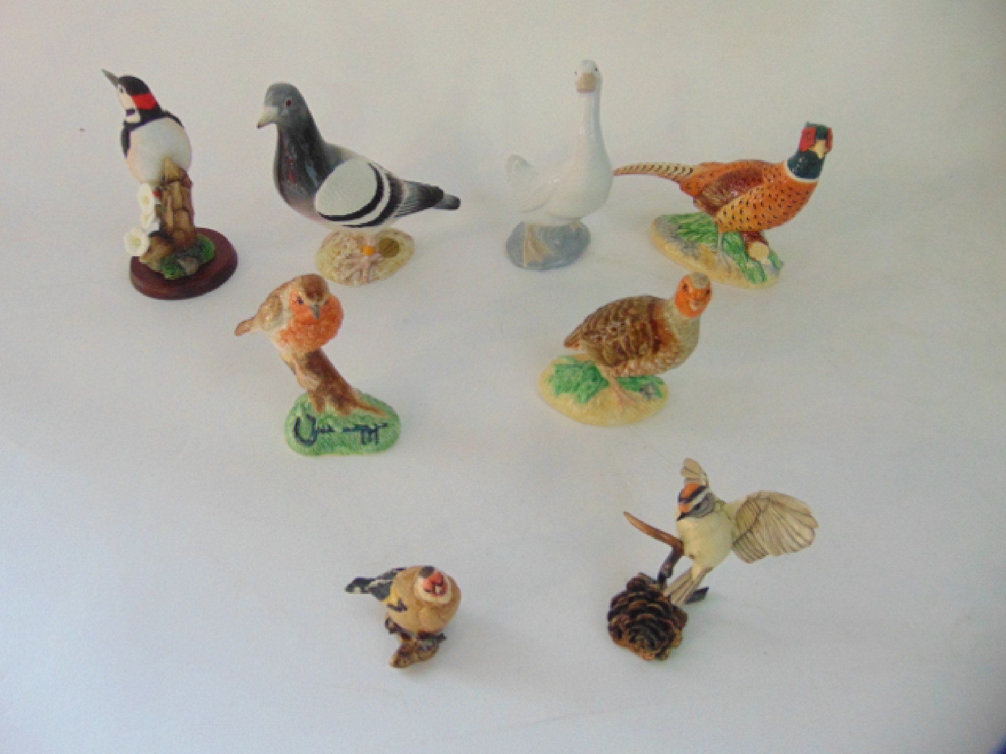 Appraisal: A collection of ceramic models of birds including John Beswick