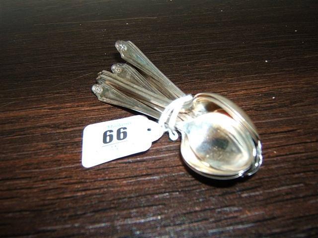 Appraisal: A set of eleven teaspoons shaped handle and shell decorated