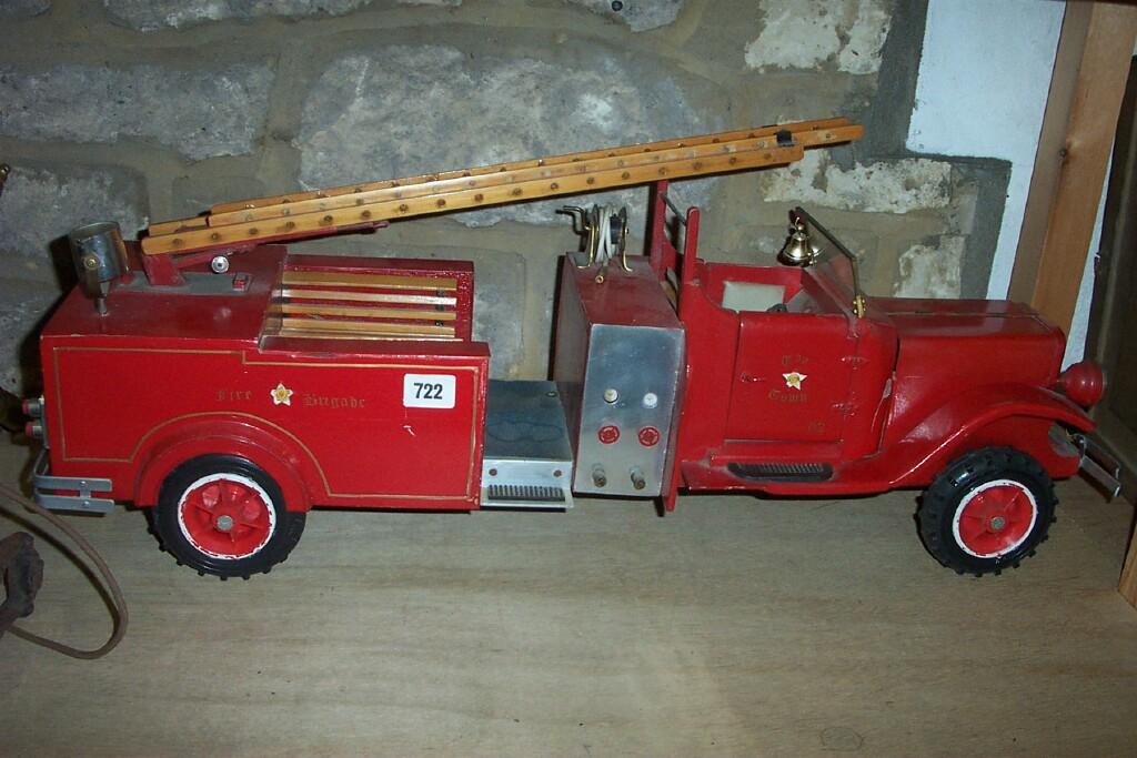 Appraisal: A Toy Town model fire engine with red painted finish