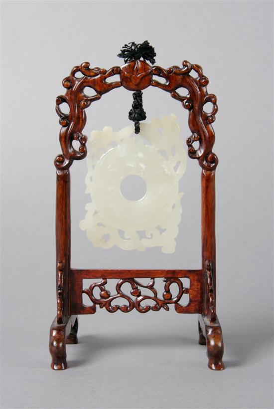 Appraisal: A Jade Medallion on Carved Wood Stand Height with stand