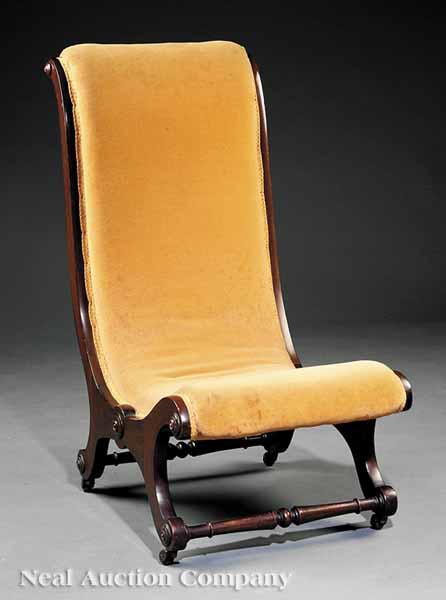 Appraisal: An English Carved Mahogany Slipper Chair mid- th c tall