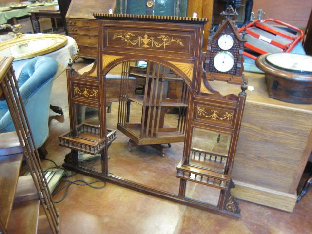 Appraisal: A late Victorian rosewood Overmantel with satinwood urn swag fan