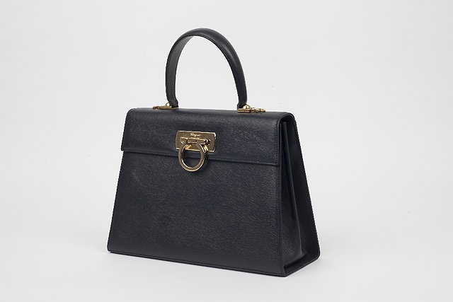 Appraisal: A Salvatore Ferragamo navy handbag with a folded top single