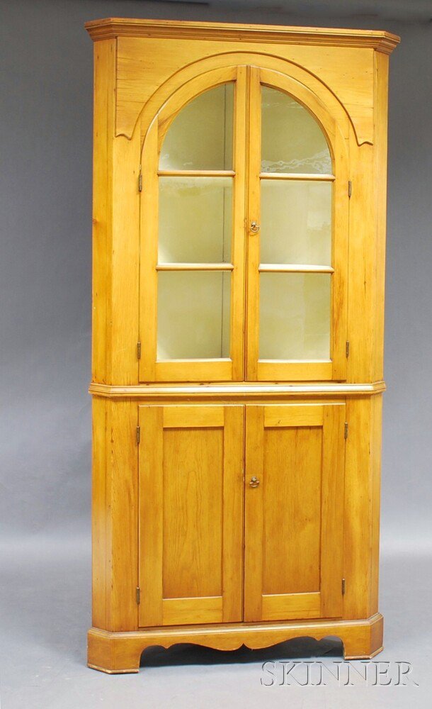 Appraisal: Glazed Pine Two-piece Corner Cupboard America th century the molded