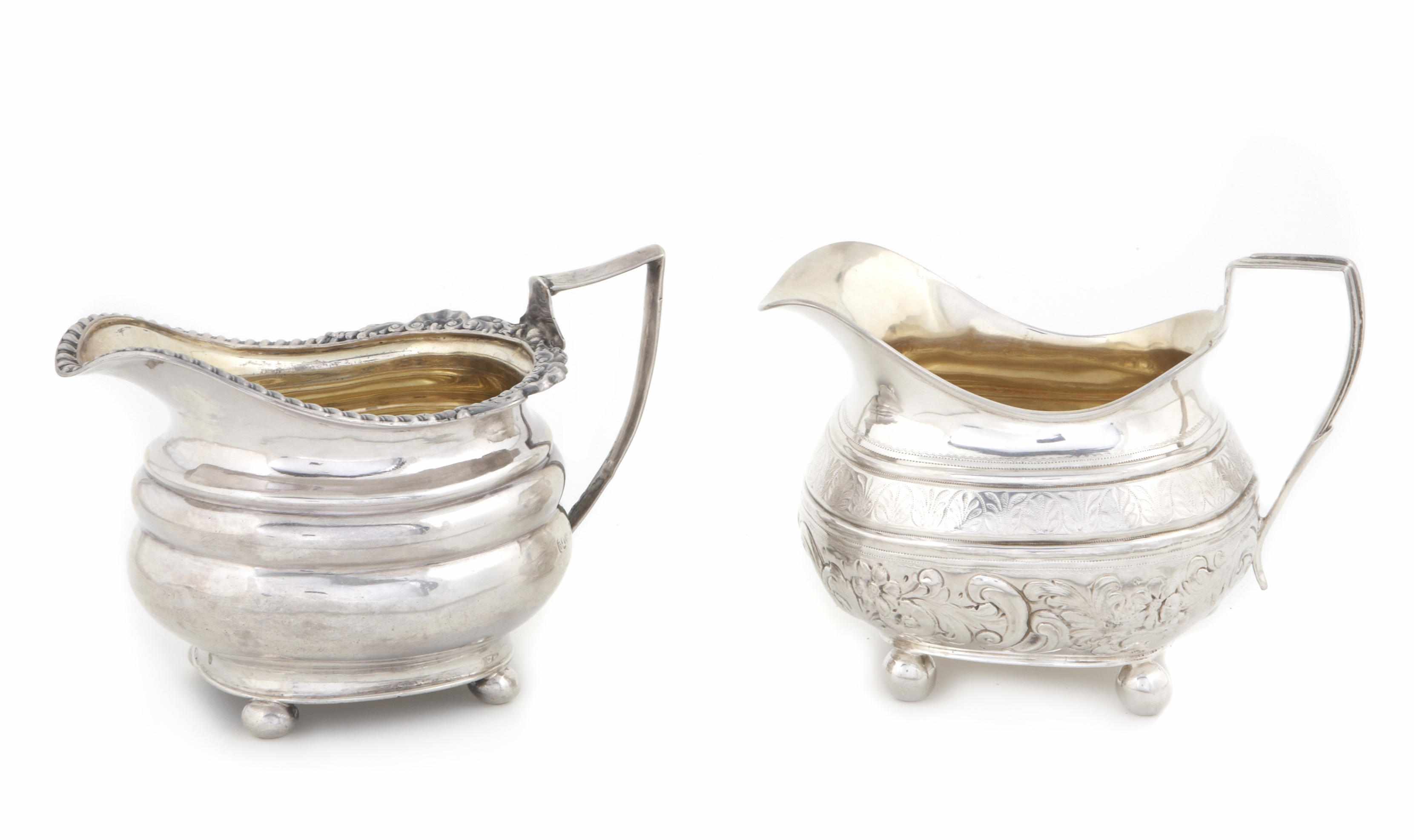 Appraisal: A Georgian silver group of two similar cream pitchers Maker's