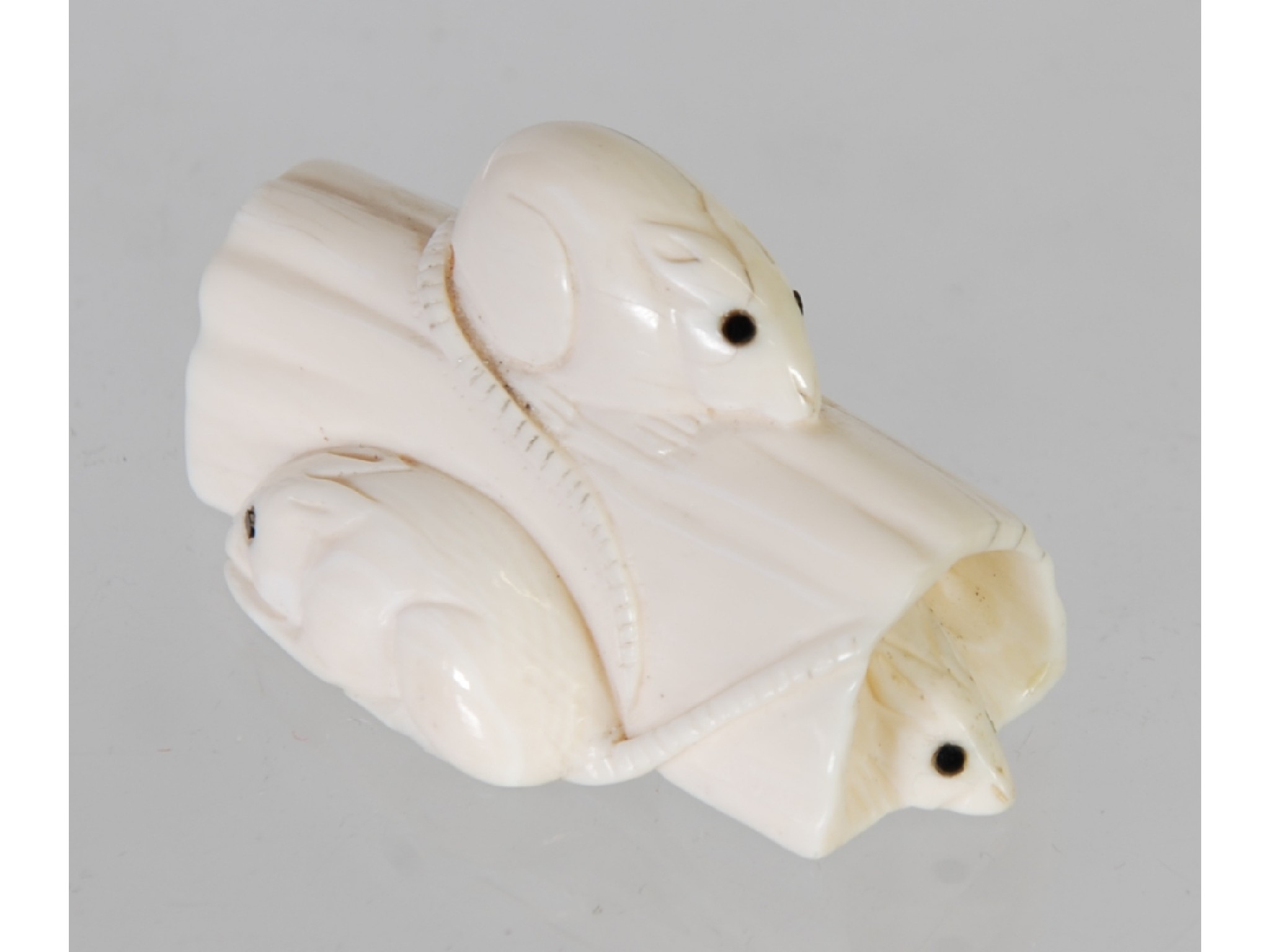 Appraisal: AN ORIENTAL CARVED IVORY NETSUKE in the form of mice