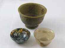 Appraisal: A moss agate and two other turned hardstone bowls