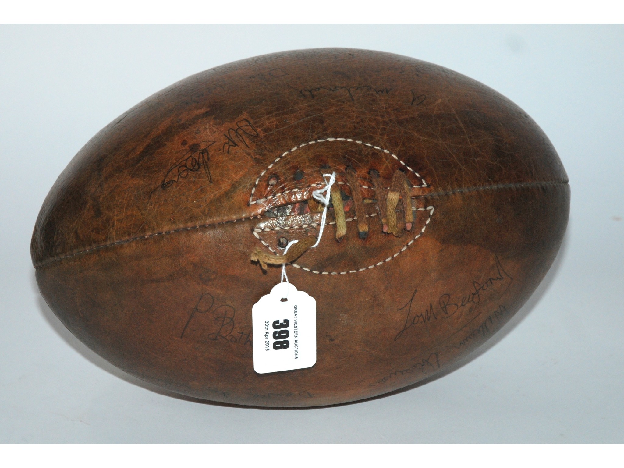 Appraisal: A brown leather rugby ball bearing autographs