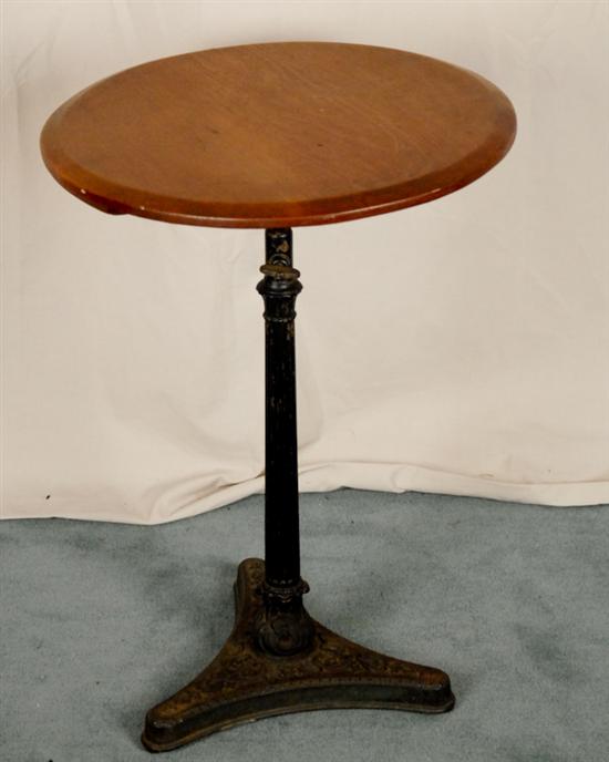 Appraisal: Victorian Stand round poplar top supported by cast iron pedestal