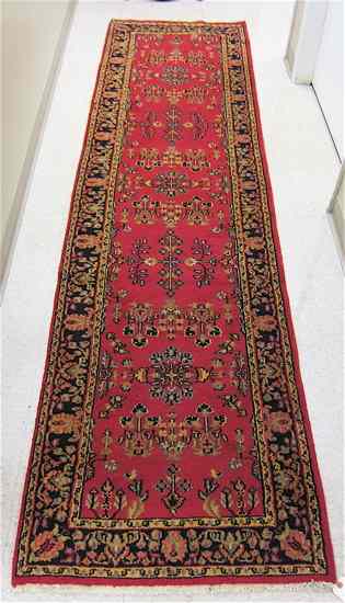 Appraisal: HAND KNOTTED ORIENTAL HALL RUG Indo-Sarouk overall floral pattern on