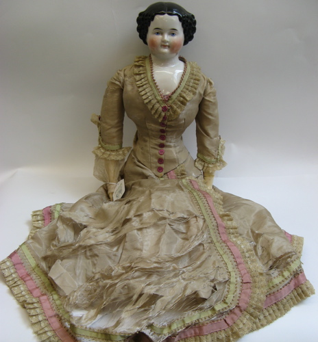 Appraisal: GERMAN LARGE SIZE CHINA HEAD DOLL L c molded and