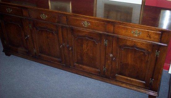 Appraisal: An oak dresser base of th Century design fitted four