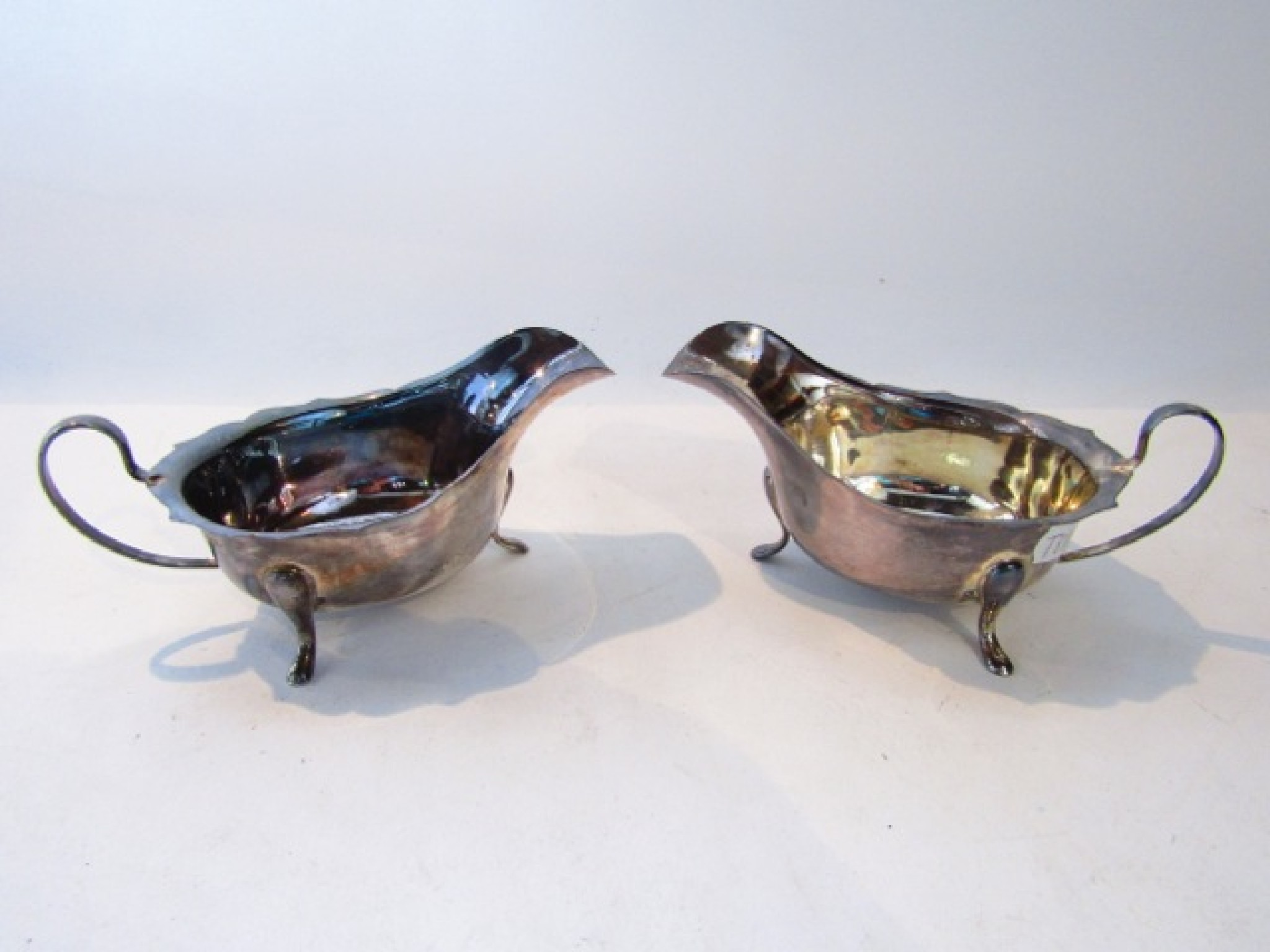 Appraisal: A pair of silver sauce boats Viner's Ltd Sheffield probably