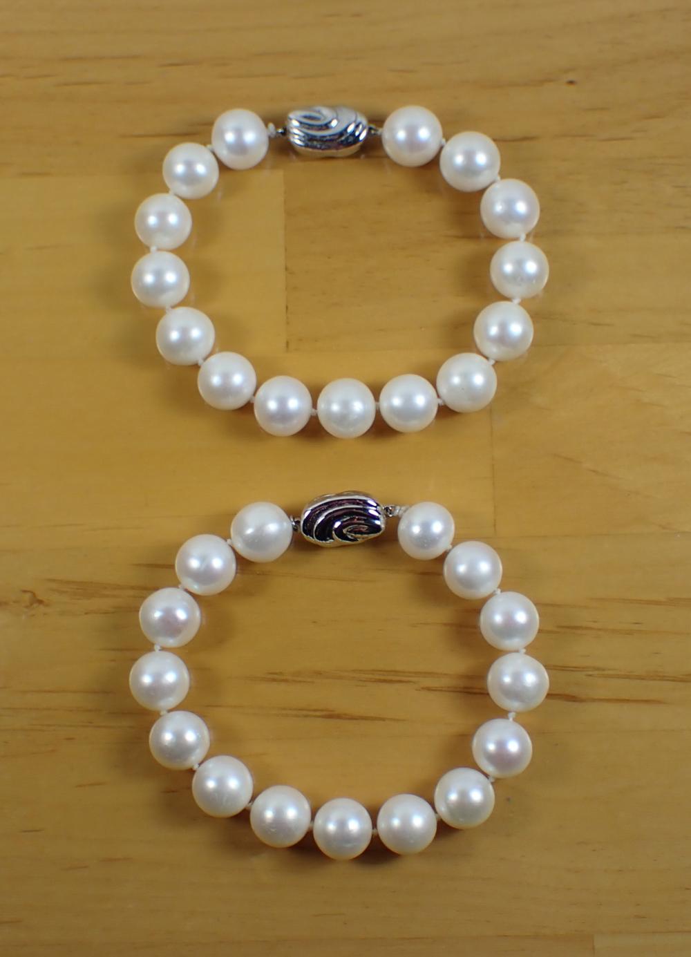 Appraisal: TWO WHITE PEARL HAND-KNOTTED BRACELETS including an - bracelet with