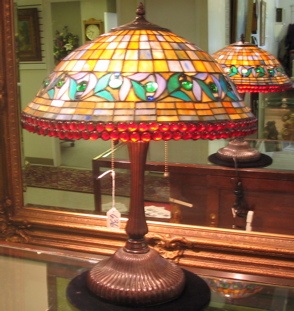 Appraisal: A TIFFANY STYLE STAINED AND LEADED GLASS LAMP two light