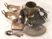 Appraisal: A wicker basket containing a quantity of silver plate including