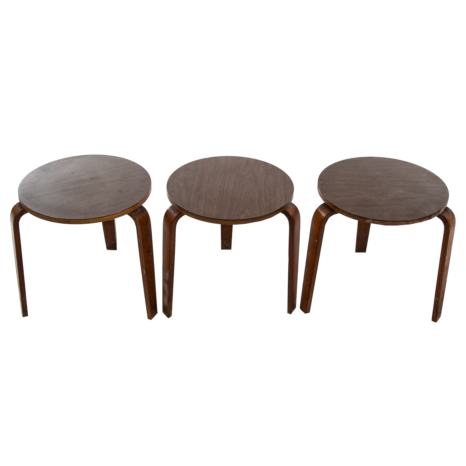 Appraisal: THREE MID-CENTURY CIRCULAR SIDE TABLES Stacking tables with laminated tops