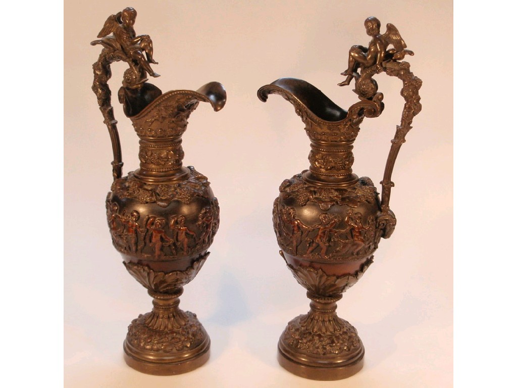 Appraisal: An impressive pair of thC bronze ewers cast in relief