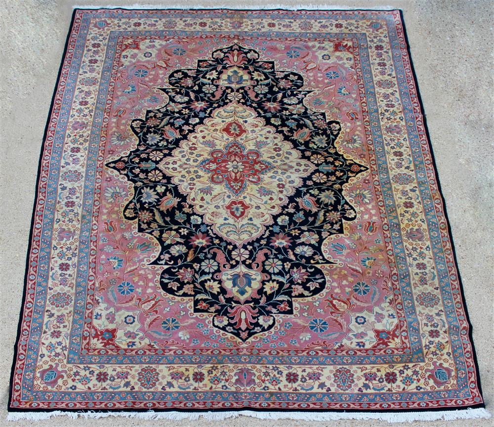 Appraisal: ROMANIAN TABRIZ WOOL ORIENTAL RUG having a central medallion with