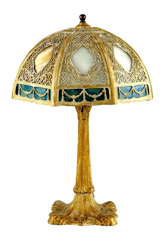 Appraisal: Cast-metal and slag glass shaded table lamp pierced paneled shade